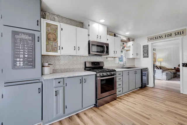 a living room filled with furniture and a book shelf