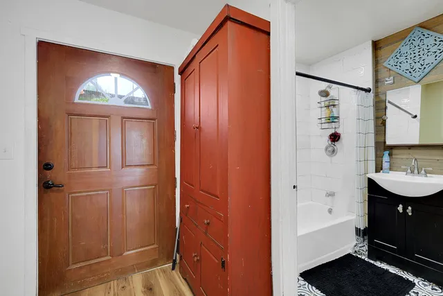 a view of a house with backyard and sitting area