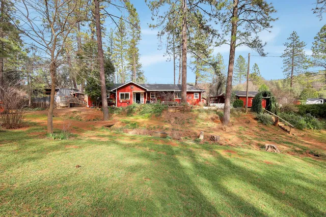 a backyard of a house with outdoor seating