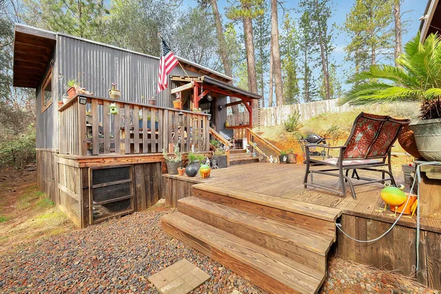 a view of a yard with a house in the background