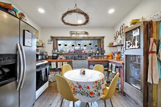 a view of yard with tree and wooden fence