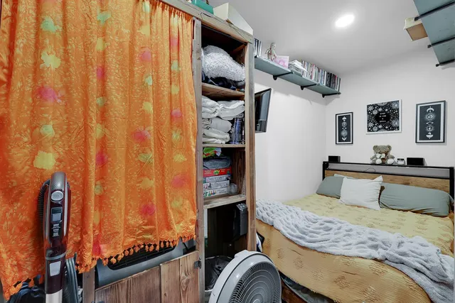 a view of a house with backyard and a trees