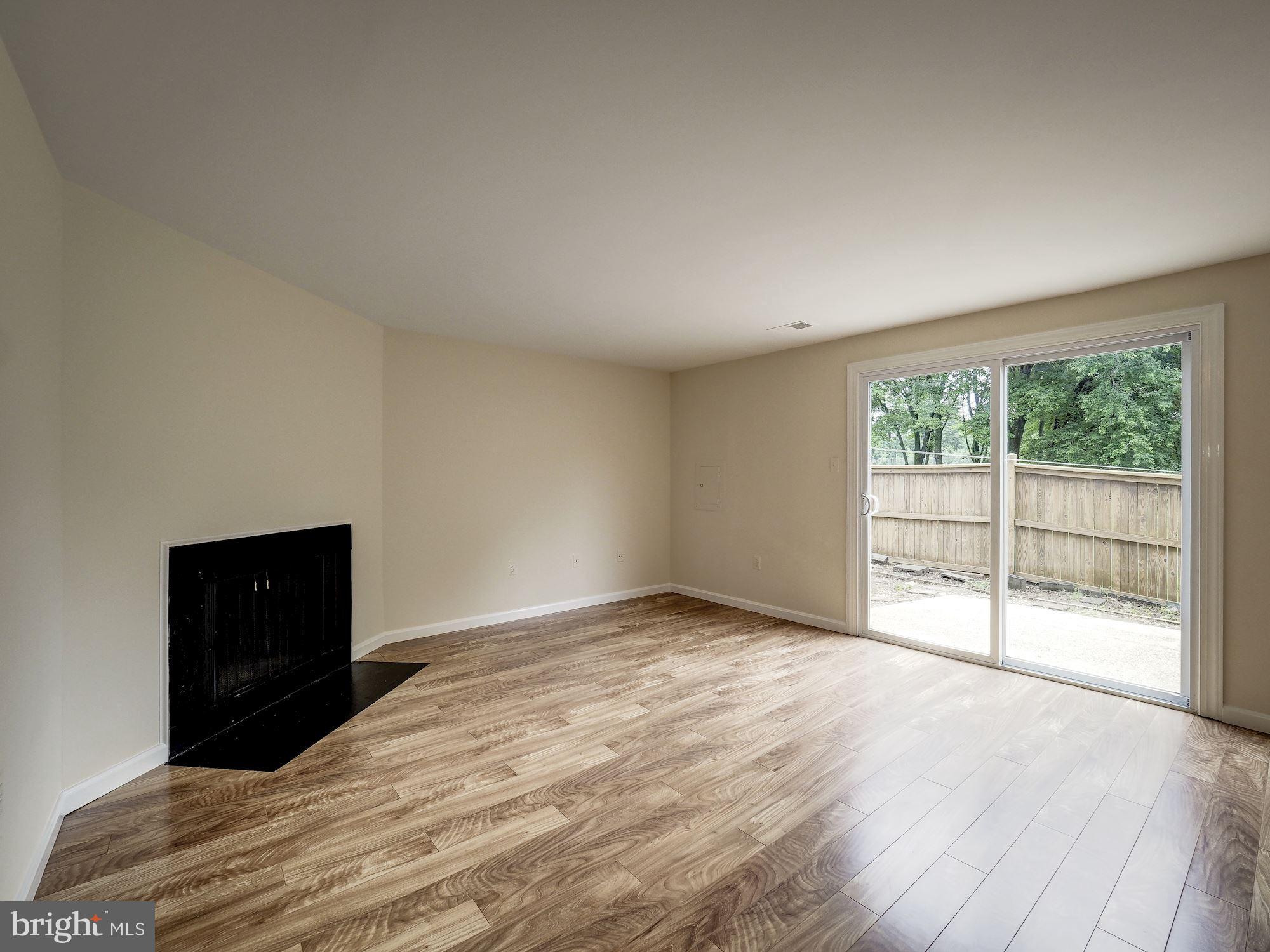 3815 Ferrara Drive Silver Spring, MD 20906 - Photo 28 of 39 Walk-out level Family Room with fireplace