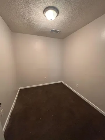 an empty room with a empty space and a window