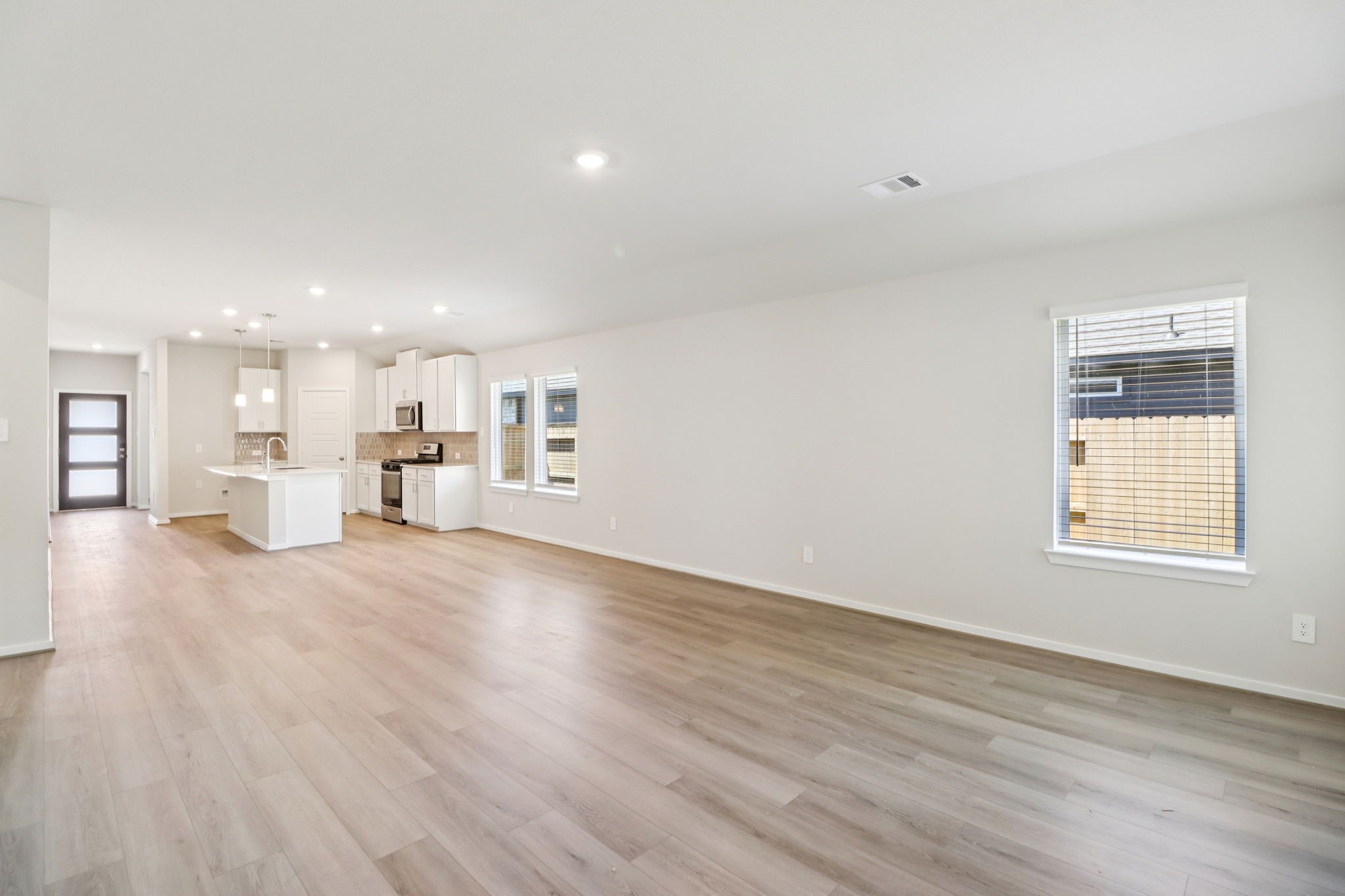 16273 Parish Pointe Court Conroe, TX 77302 - Photo 5 of 29 a view of a kitchen with a sink and a window