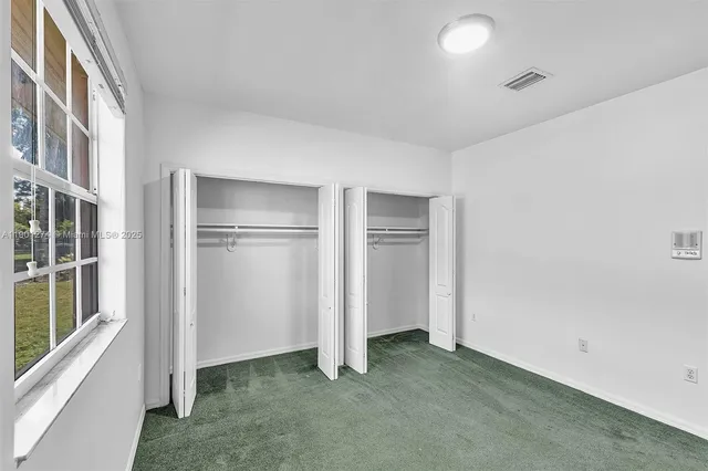 a view of a backyard with a garden