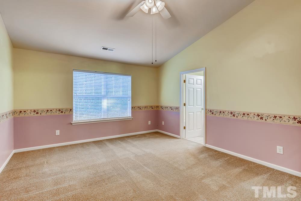 4906 Ravel Stone Court Raleigh, NC 27610 - Photo 14 of 28 a view of an empty room with a window