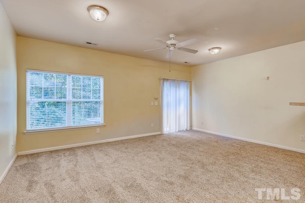 4906 Ravel Stone Court Raleigh, NC 27610 - Photo 4 of 28 an empty room with windows