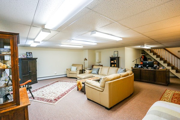 18 Saddle Hill Road Boxford, MA 01921 - Photo 18 of 20 a living room with furniture and a flat screen tv