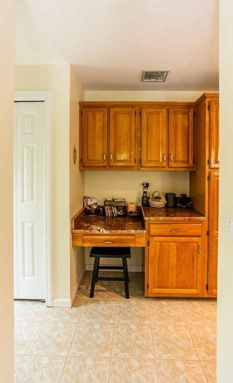 18 Saddle Hill Road Boxford, MA 01921 - Photo 8 of 20 a view of a kitchen with granite countertop cabinets and a refrigerator