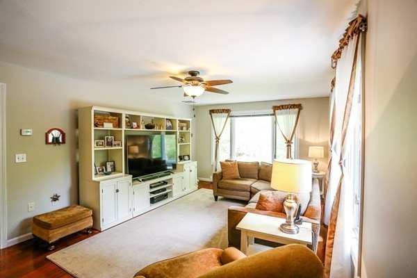 18 Saddle Hill Road Boxford, MA 01921 - Photo 10 of 20 a living room with furniture and a flat screen tv