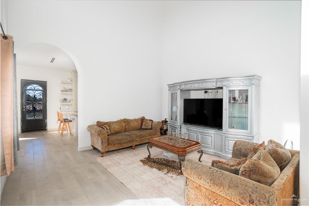 15421 Mile 20 Road Edinburg, TX 78542 - Photo 13 of 24 a living room with furniture and a flat screen tv
