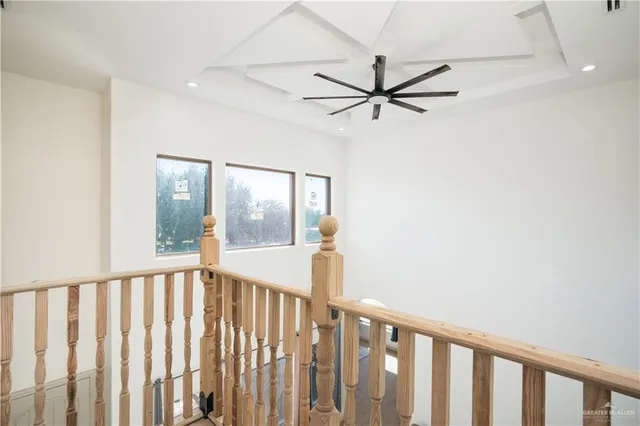 a bathroom with a granite countertop sink a mirror and shower