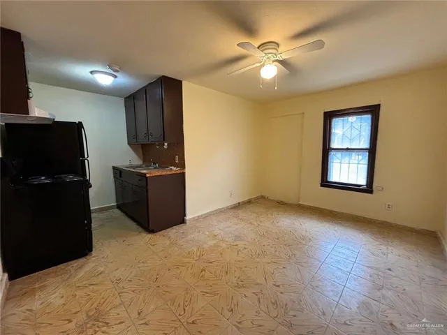 a view of a livingroom with a kitchen