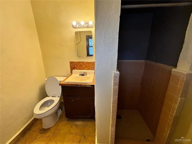 a bathroom with a toilet and a sink