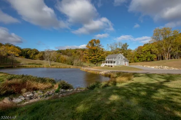 a view of lake with green space