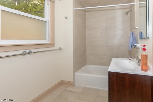 a bathroom with a bathtub and a sink