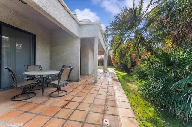 a view of a backyard with sitting area