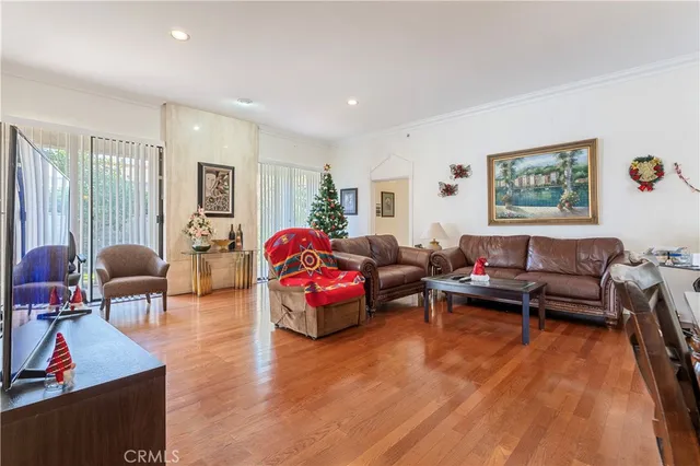 a living room with furniture a rug and a window
