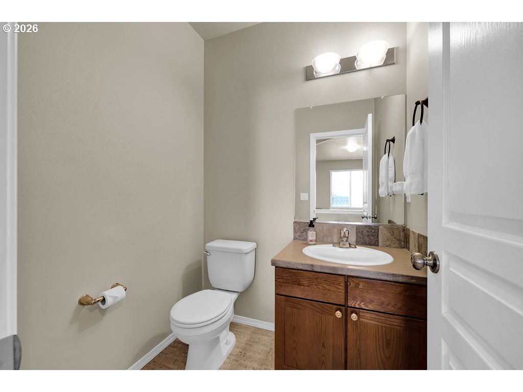 654 North Garden Way Eugene, OR 97401 - Photo 18 of 47 a bathroom with a sink and a mirror