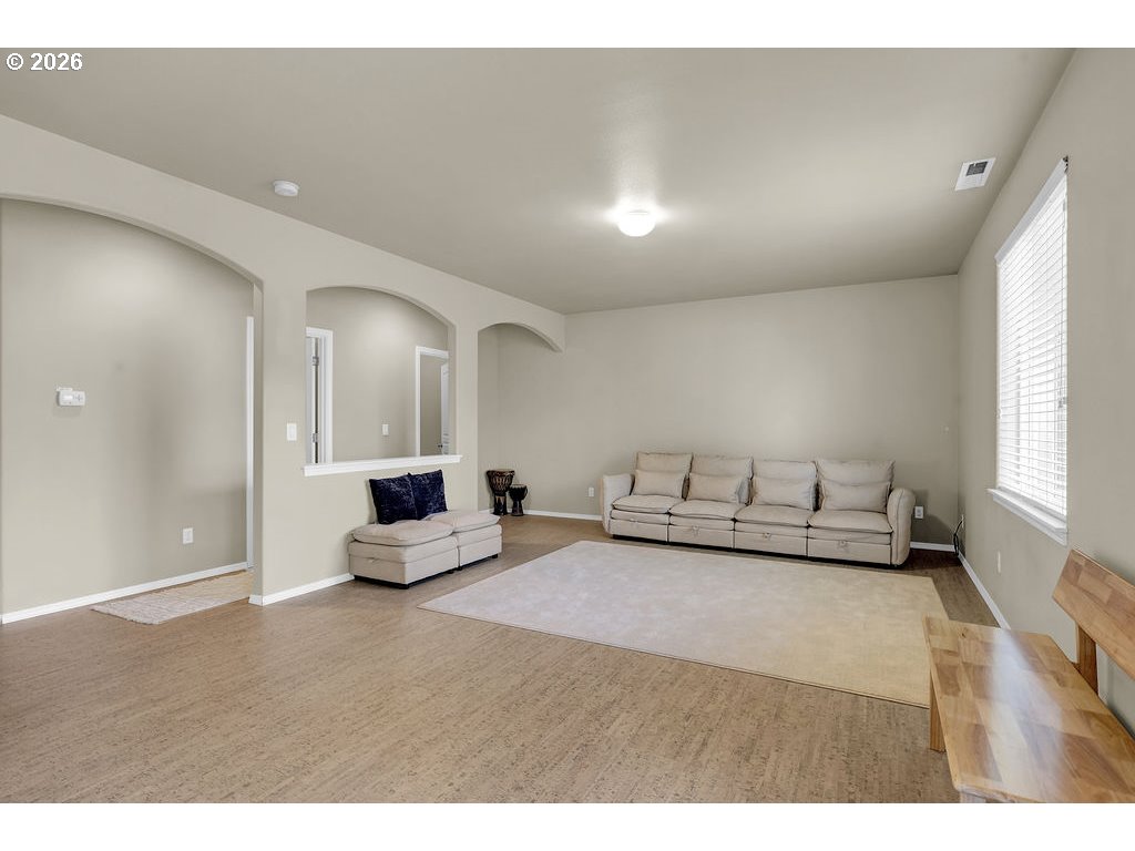 654 North Garden Way Eugene, OR 97401 - Photo 21 of 47 a living room with furniture and a large window