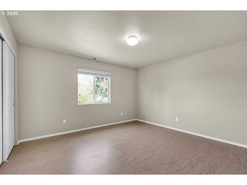 654 North Garden Way Eugene, OR 97401 - Photo 30 of 47 a view of an empty room with a window