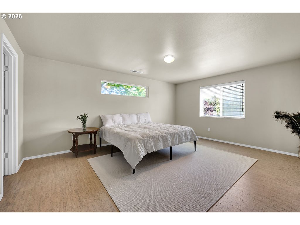 654 North Garden Way Eugene, OR 97401 - Photo 34 of 47 a bedroom with a bed and a window