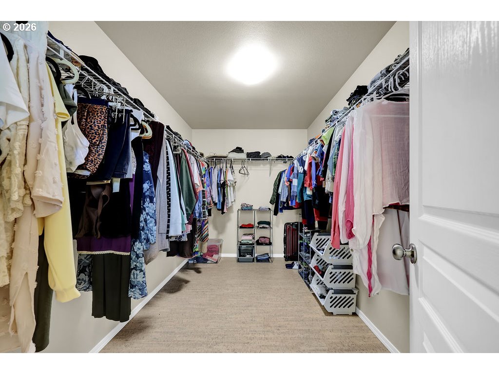 654 North Garden Way Eugene, OR 97401 - Photo 38 of 47 a view of walk in closet with clothes