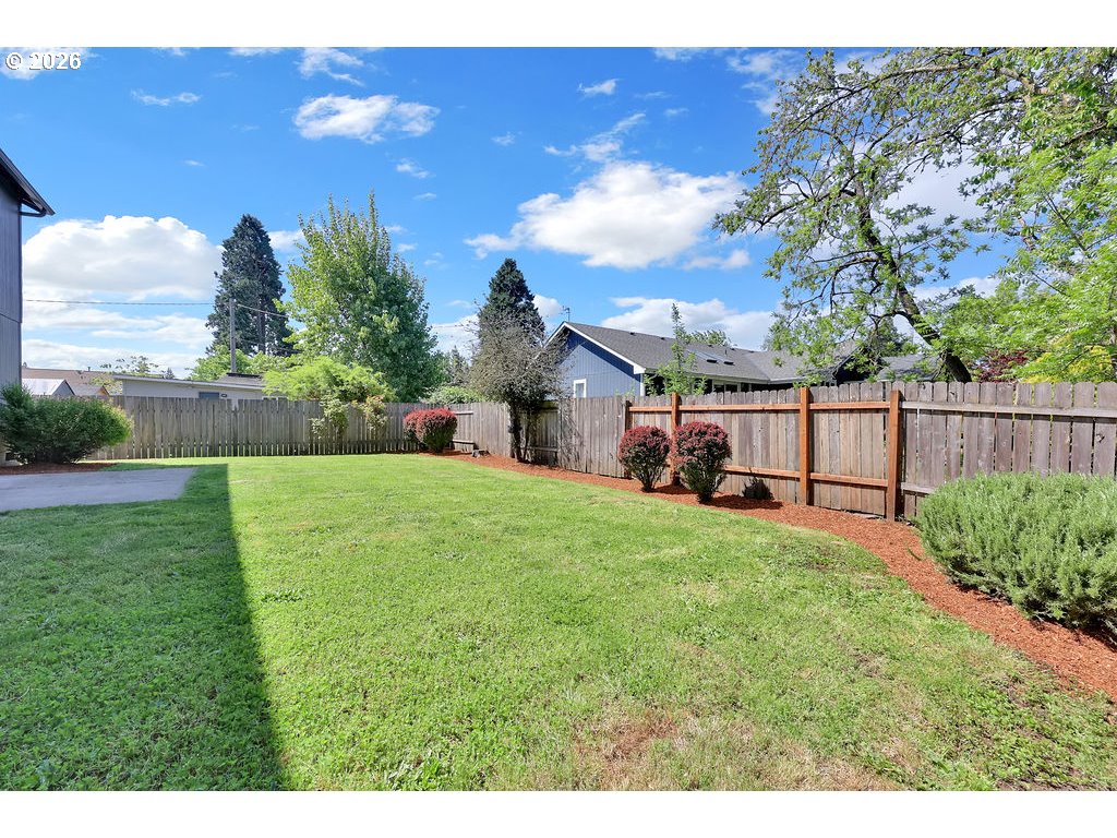 654 North Garden Way Eugene, OR 97401 - Photo 46 of 47 a view of backyard with seating area and green space