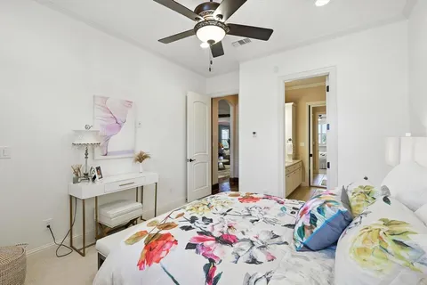 a bathroom with a double vanity sink a mirror and a bathtub
