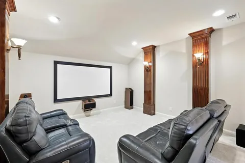 a bedroom with a bed and a lamp on table