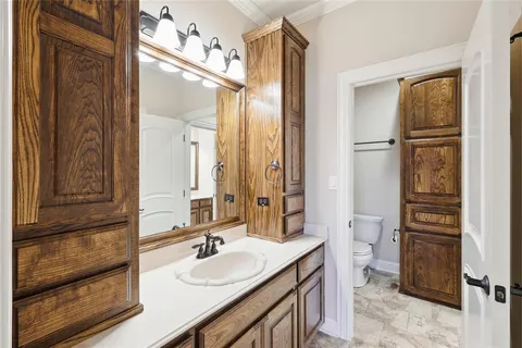 a bathroom with a sink double vanity and a mirror