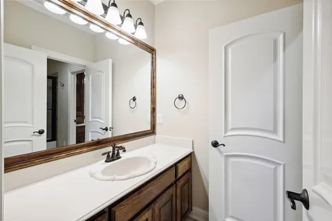 a bedroom with bed and a chair