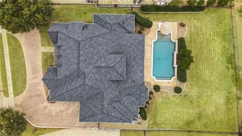 an aerial view of a house with a garden