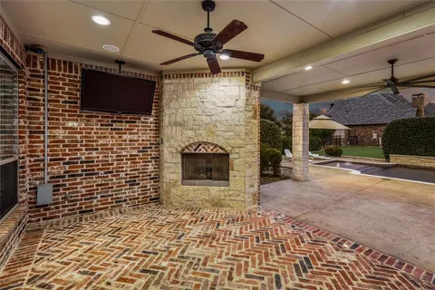 a view of a house with pool and sitting area