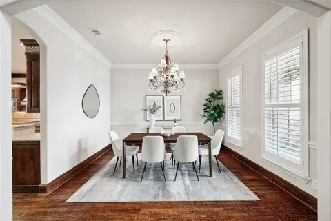 a room with furniture wooden floor and a window