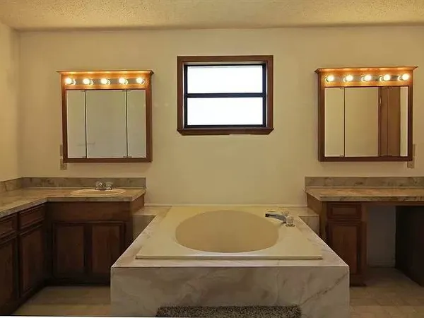 a bathroom with a sink and a bathtub