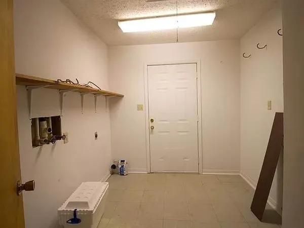 a view of backyard with trampoline