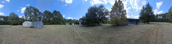 a view of a yard with a small house