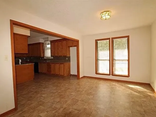a view of a kitchen with a sink and cabinets