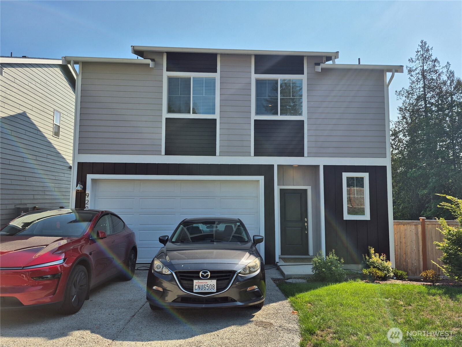 9204 Mint Loop Northwest Bremerton, WA 98311 - Photo 1 of 26 a car parked in front of a house