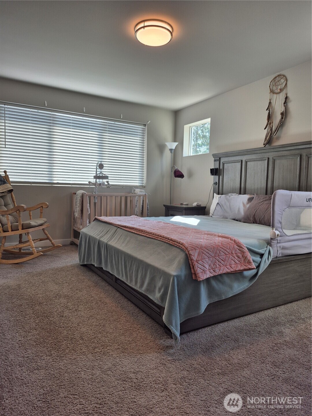 9204 Mint Loop Northwest Bremerton, WA 98311 - Photo 11 of 26 a bedroom with a bed and window