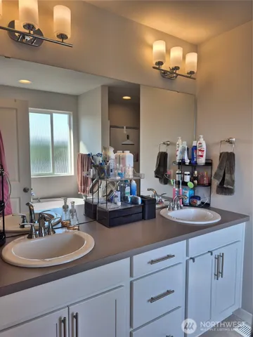 a bathroom with sink and mirror