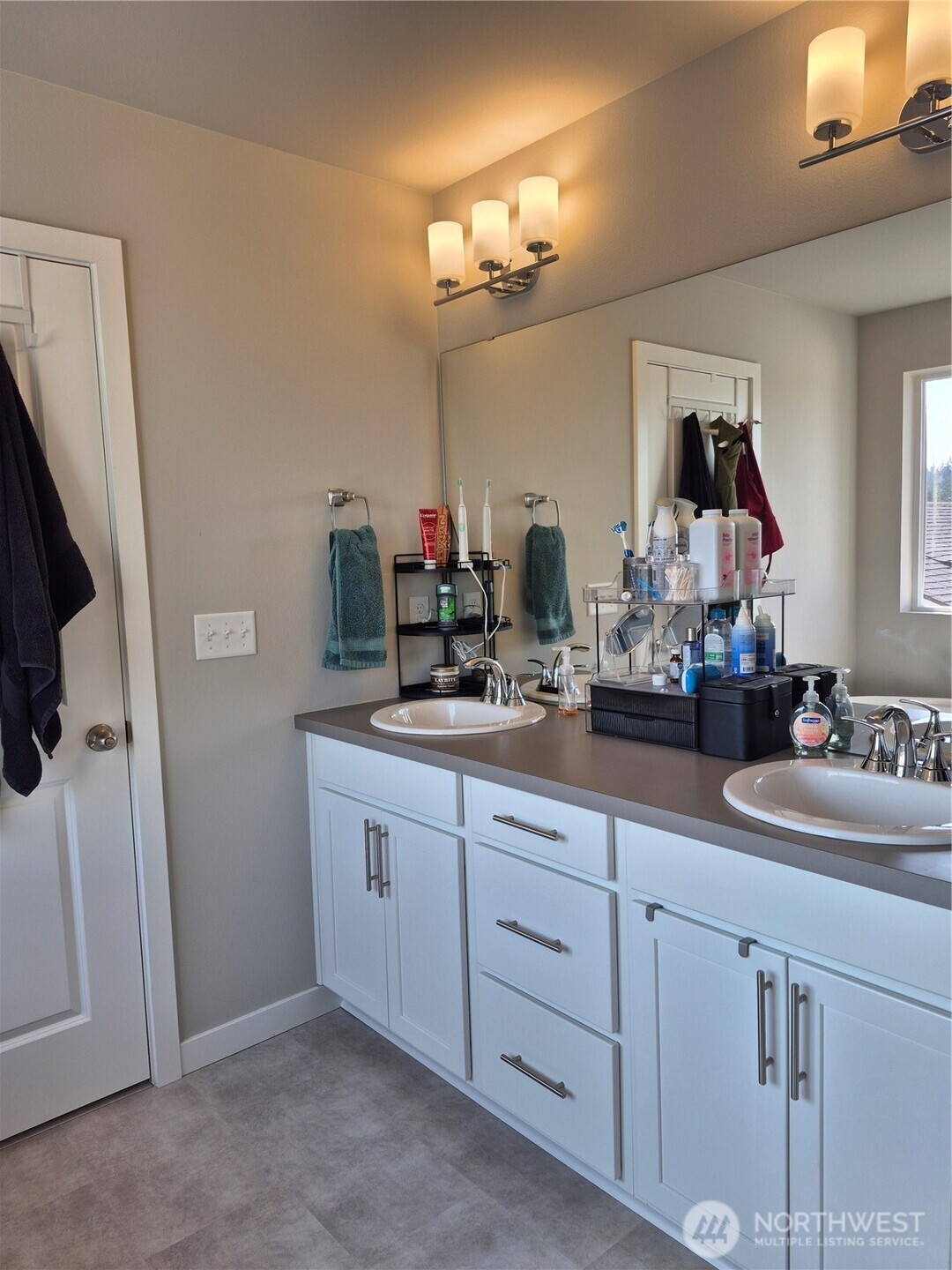 9204 Mint Loop Northwest Bremerton, WA 98311 - Photo 17 of 26 a bathroom with double vanity sink and a mirror