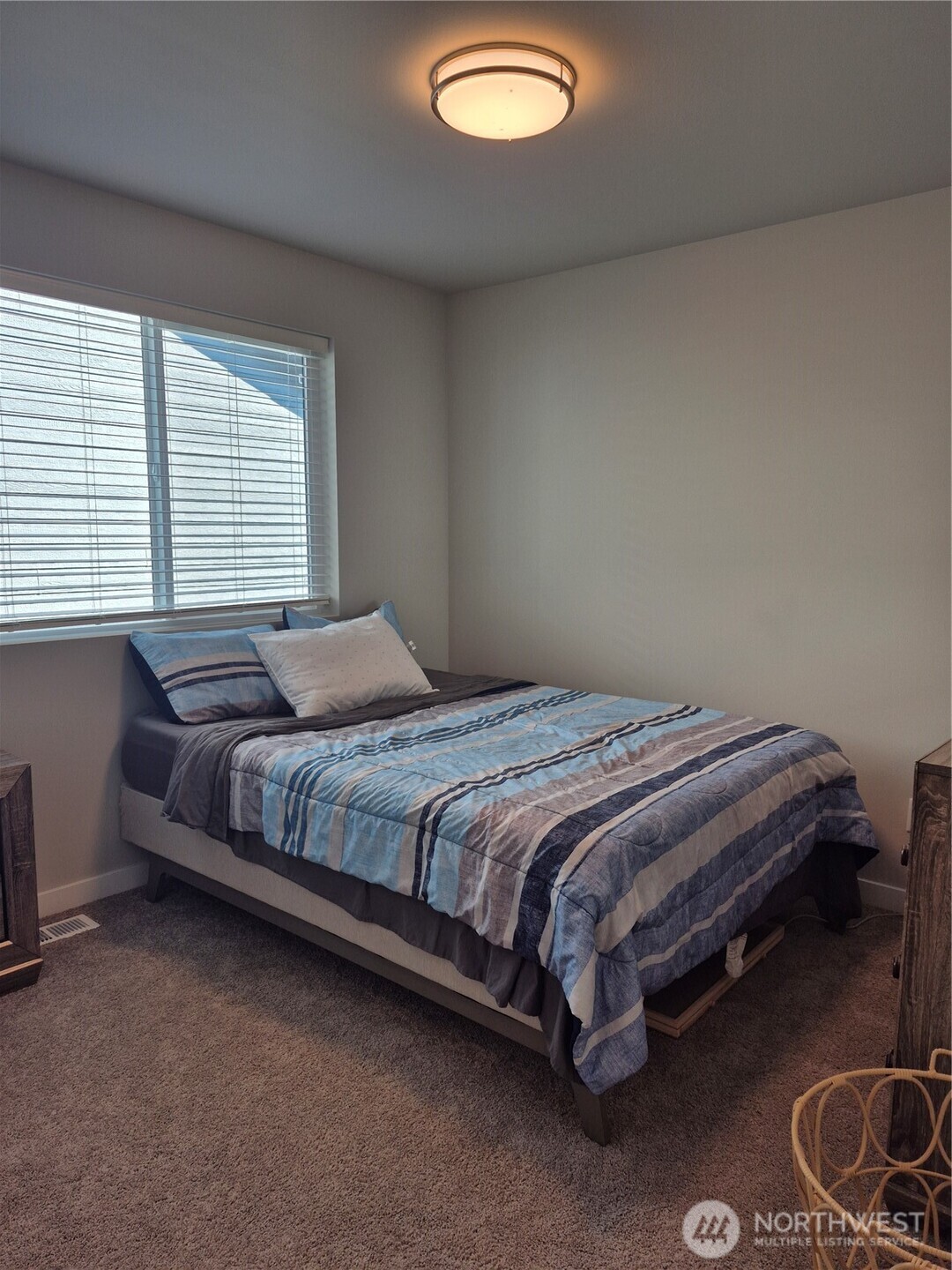 9204 Mint Loop Northwest Bremerton, WA 98311 - Photo 19 of 26 a bedroom with a bed and a window