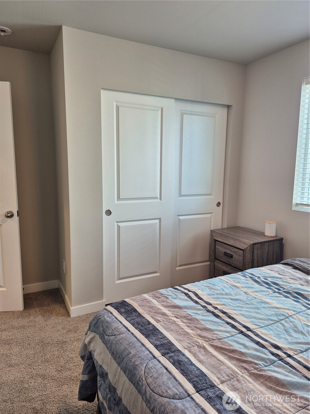 9204 Mint Loop Northwest Bremerton, WA 98311 - Photo 20 of 26 a bedroom with a bed and a window