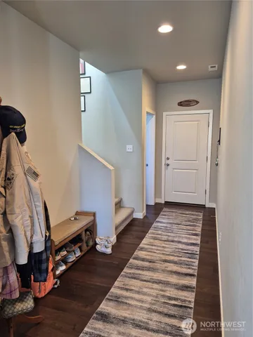 a view of a livingroom with furniture and a workspace