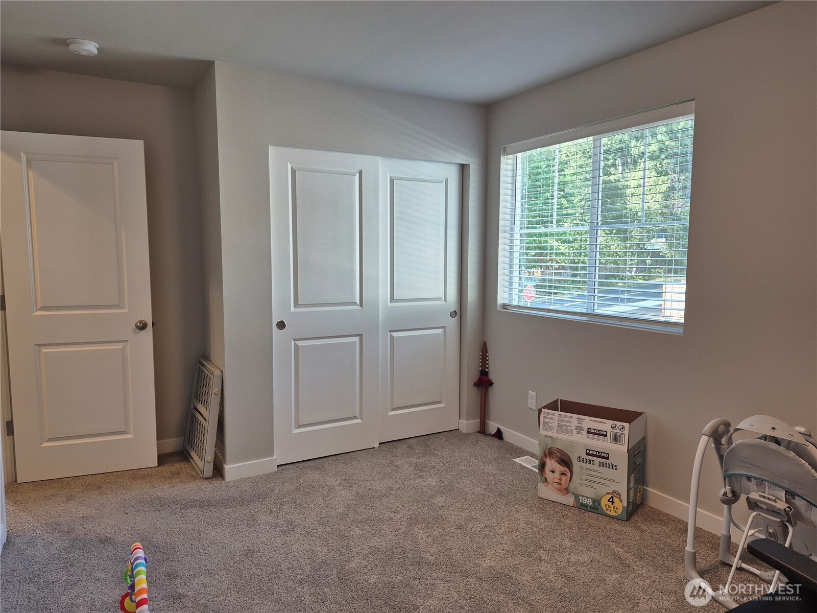 9204 Mint Loop Northwest Bremerton, WA 98311 - Photo 23 of 26 an empty room with windows and closet