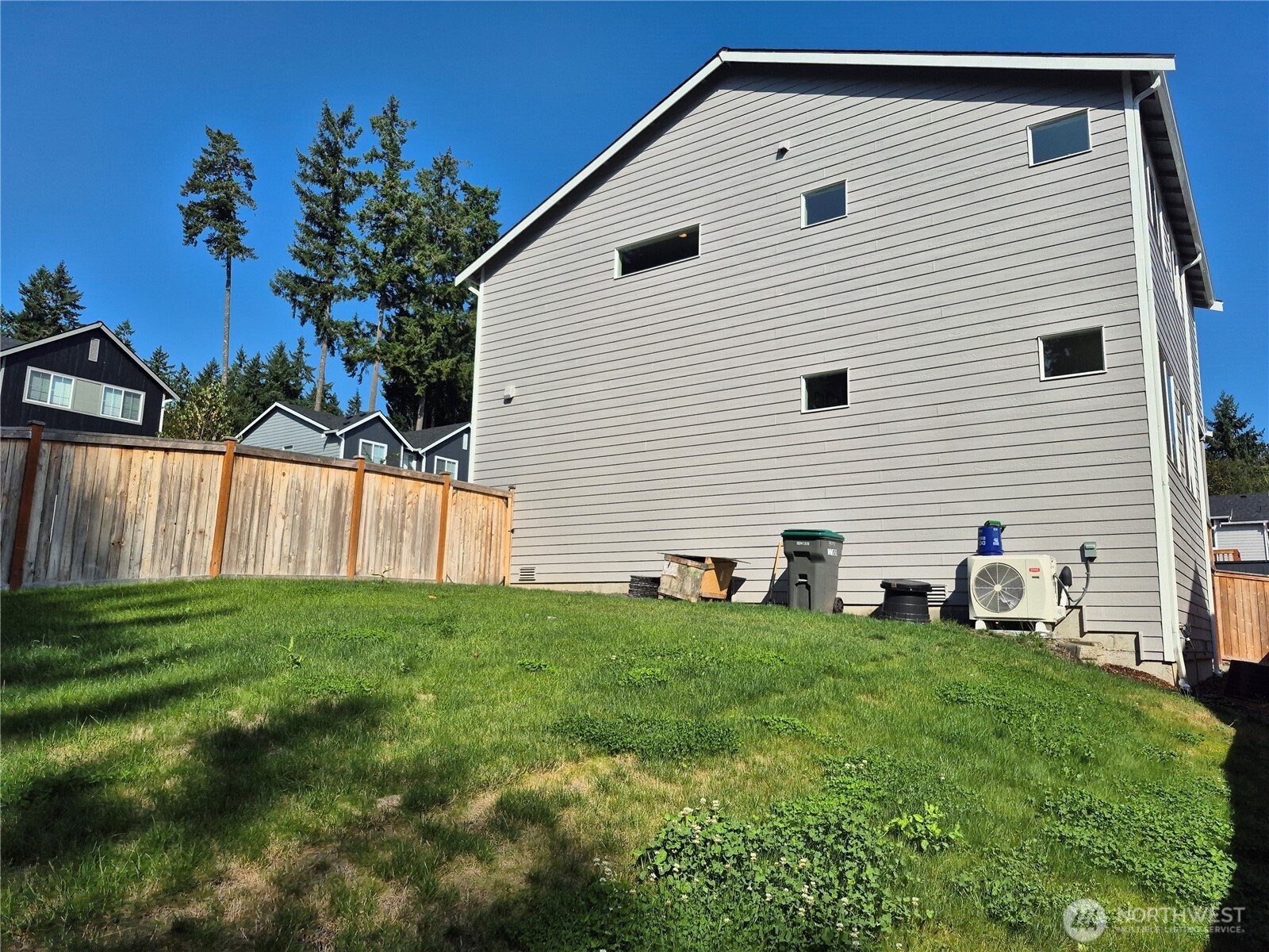 9204 Mint Loop Northwest Bremerton, WA 98311 - Photo 26 of 26 a front view of a house with a yard