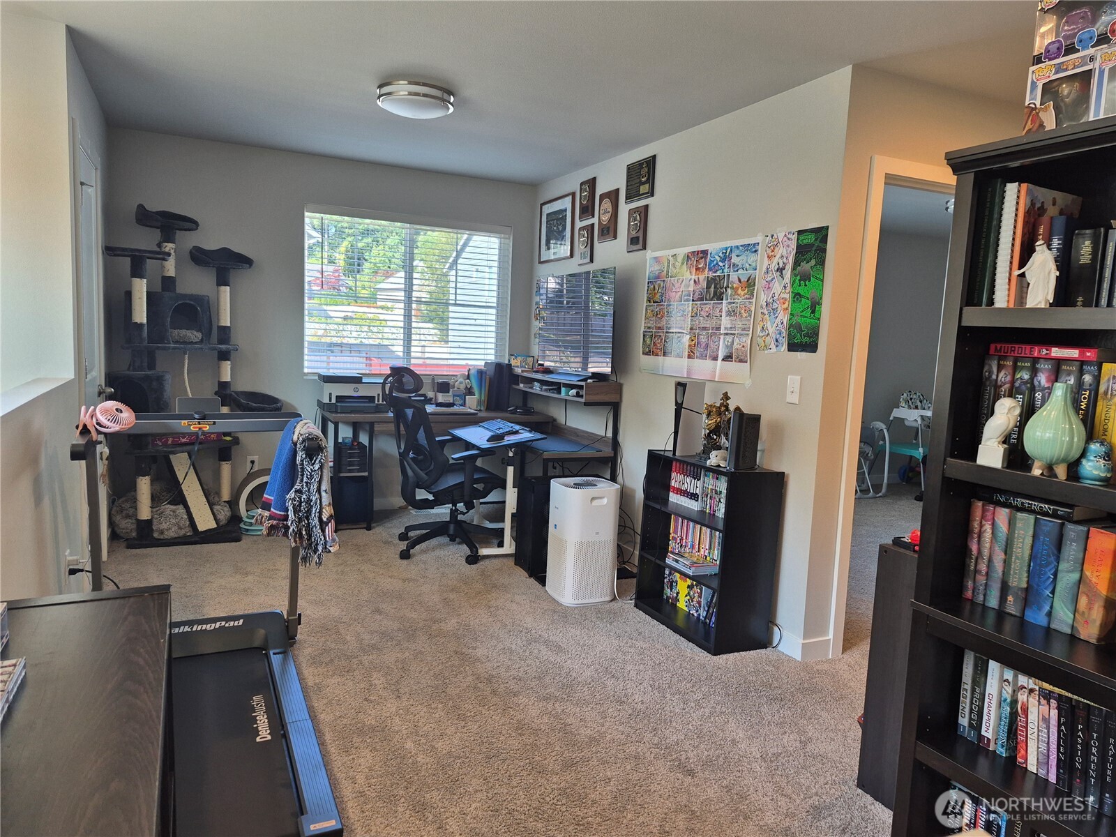 9204 Mint Loop Northwest Bremerton, WA 98311 - Photo 8 of 26 a view of a workspace with furniture and a bookshelf